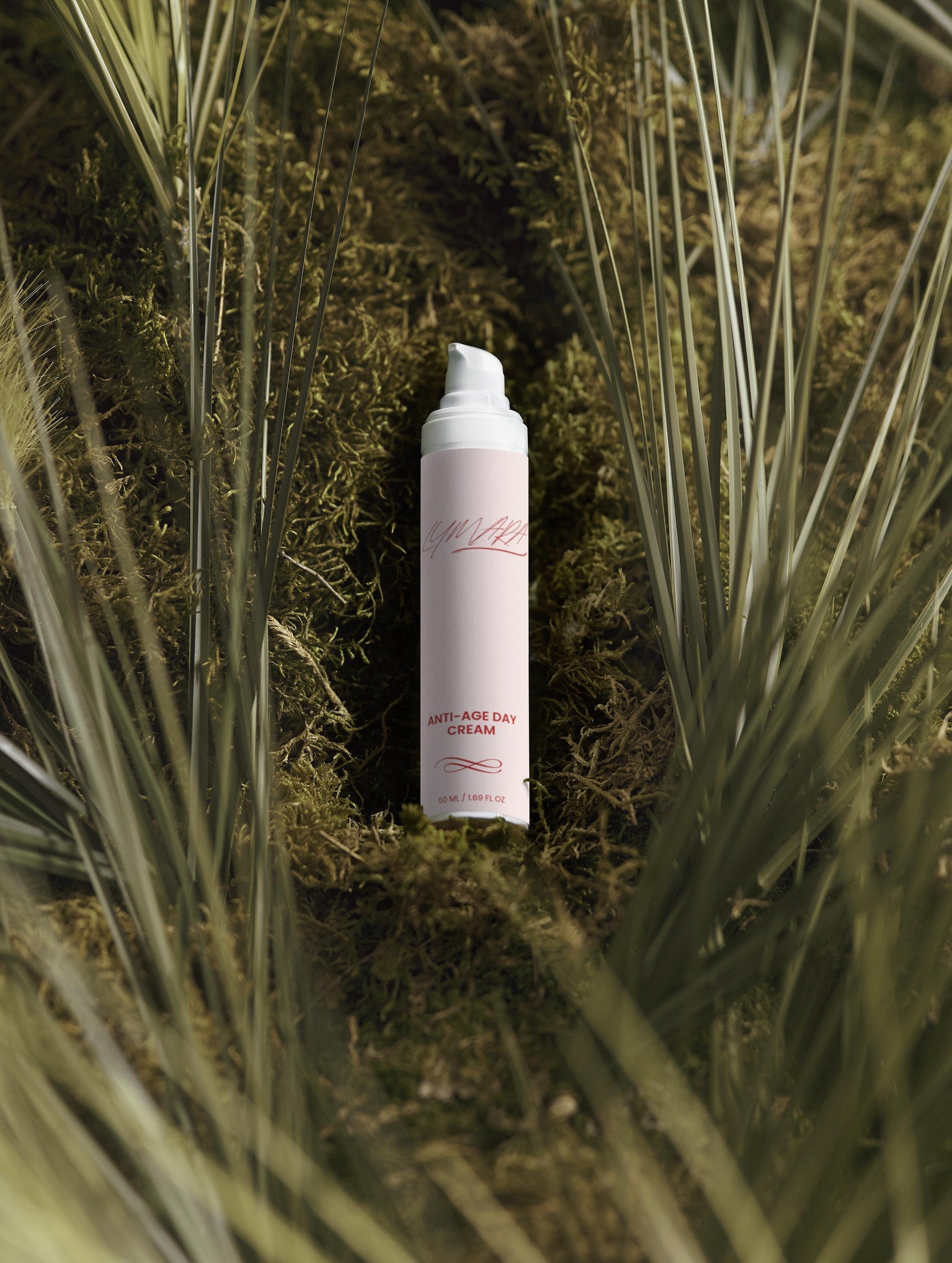 Anti-Age Day Cream bottle nestled among green foliage, showcasing its velvety texture and innovative formula.