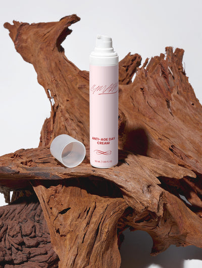 Anti-Age Day Cream bottle on wooden surface, promoting smoother skin and youthful appearance.